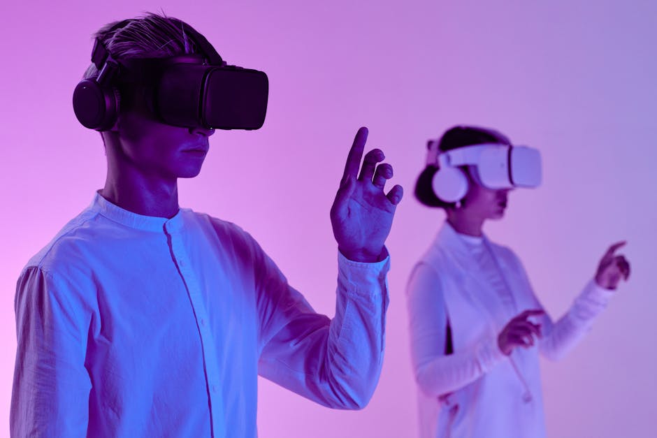 Two people engage in a futuristic virtual reality simulation with headsets and vibrant lighting.